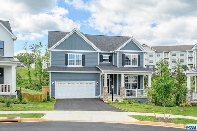 3707 Thicket Run Pl, Charlottesville, VA 22911 - view of front facade with covered porch, board and batten siding, driveway, an attached garage, and roof with shingles
