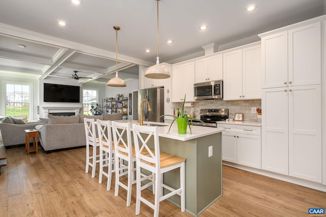 3707 Thicket Run Pl, Charlottesville, VA 22911 - kitchen with appliances with stainless steel finishes, ceiling fan, a kitchen breakfast bar, tasteful backsplash, and coffered ceiling
