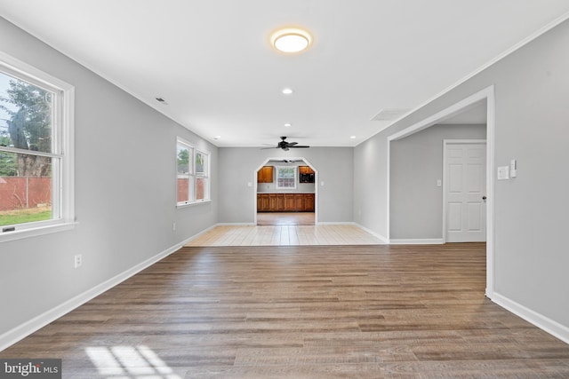 95 Twin Oak Dr, Levittown, PA 19056 - unfurnished living room featuring ceiling fan, light wood-type flooring, baseboards, recessed lighting, and crown molding