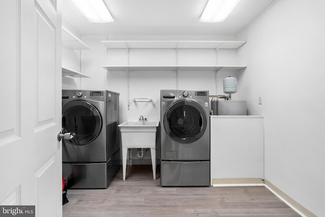 95 Twin Oak Dr, Levittown, PA 19056 - laundry area featuring light wood-style floors and washer and clothes dryer