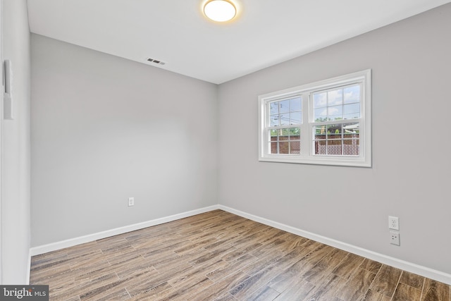 95 Twin Oak Dr, Levittown, PA 19056 - empty room with wood finished floors and baseboards