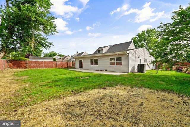 95 Twin Oak Dr, Levittown, PA 19056 - back of property featuring a patio and central AC