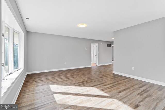 95 Twin Oak Dr, Levittown, PA 19056 - empty room with baseboards and wood finished floors