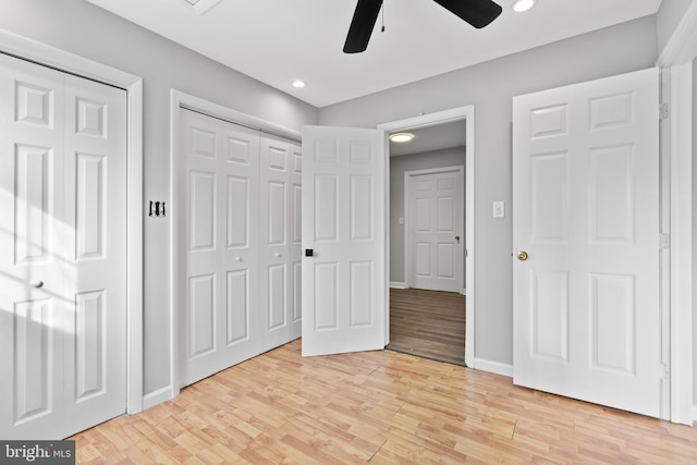 95 Twin Oak Dr, Levittown, PA 19056 - unfurnished bedroom with light wood finished floors, baseboards, recessed lighting, multiple closets, and ceiling fan