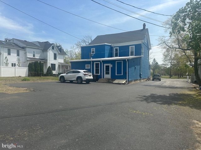 3 E Mantua Ave, Wenonah, NJ 08090 - view of front facade with entry steps, a chimney, and a residential view