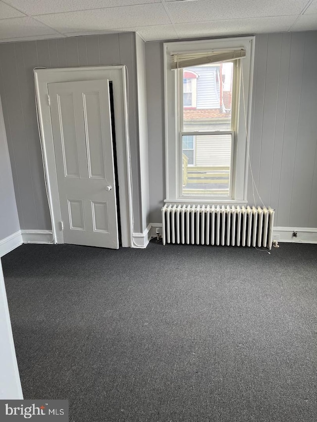 3 E Mantua Ave, Wenonah, NJ 08090 - carpeted spare room featuring radiator heating unit, baseboards, and a decorative wall
