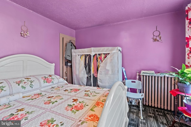 2824 Ashland Ave, Baltimore, MD 21205 - bedroom with radiator and a textured ceiling