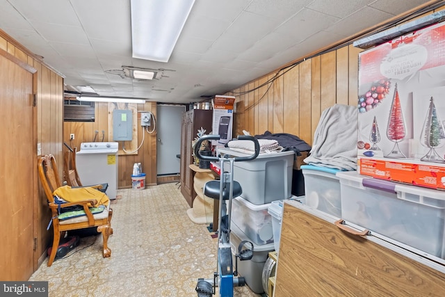 2824 Ashland Ave, Baltimore, MD 21205 - finished below grade area with wood walls, washer / clothes dryer, tile patterned floors, and electric panel