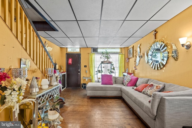 2824 Ashland Ave, Baltimore, MD 21205 - living room with stairs, wood finished floors, a drop ceiling, and baseboards