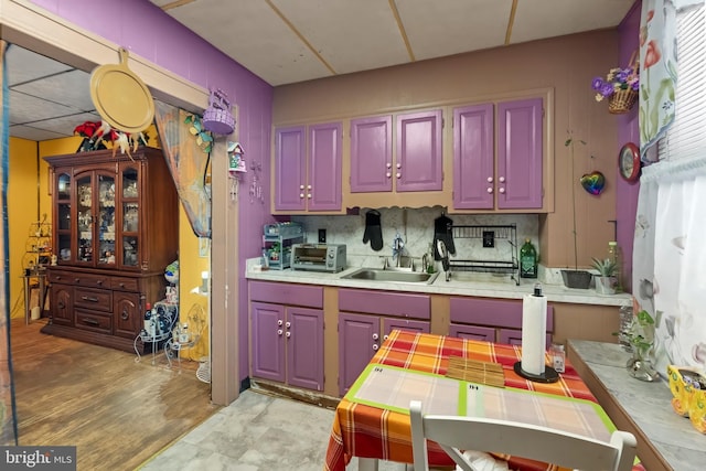 2824 Ashland Ave, Baltimore, MD 21205 - kitchen featuring a sink, backsplash, and light countertops