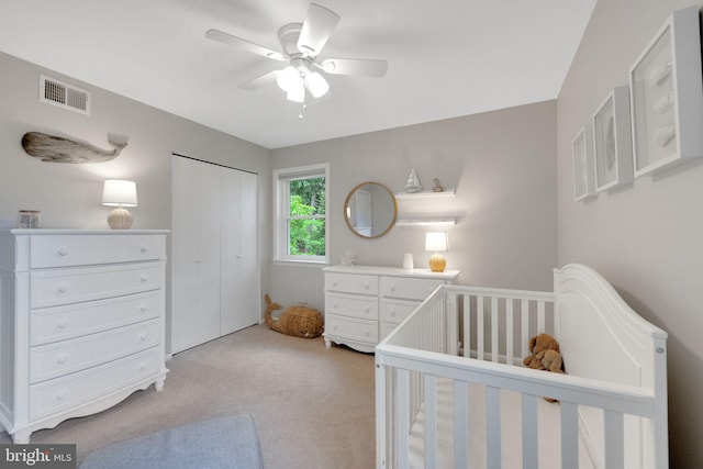 1995 Pierce Dr, Whitehall, PA 18052 - bedroom with light carpet, a closet, a crib, and ceiling fan