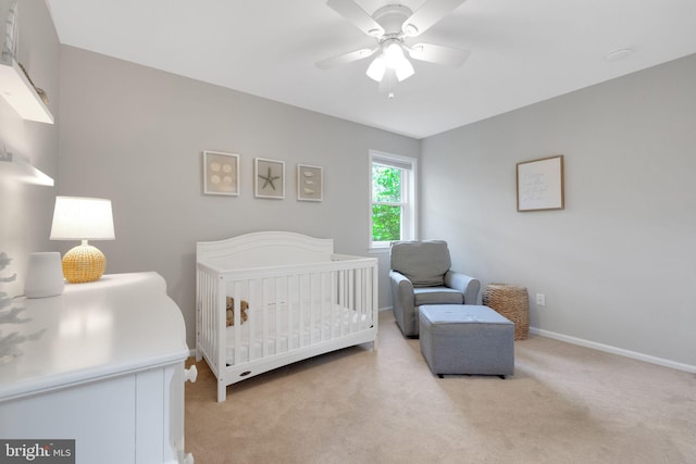 1995 Pierce Dr, Whitehall, PA 18052 - bedroom with light carpet, a crib, baseboards, and ceiling fan