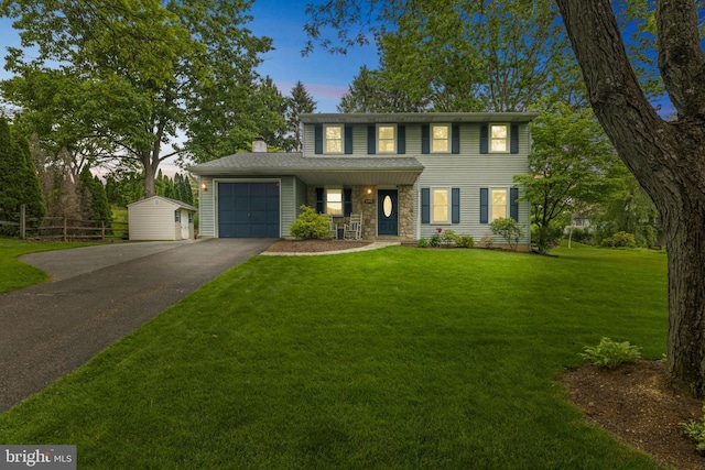 1995 Pierce Dr, Whitehall, PA 18052 - colonial home featuring driveway, an attached garage, a chimney, covered porch, and stone siding