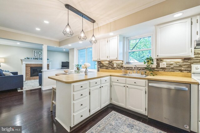 1995 Pierce Dr, Whitehall, PA 18052 - kitchen with stainless steel dishwasher, a sink, ornamental molding, a peninsula, and open floor plan