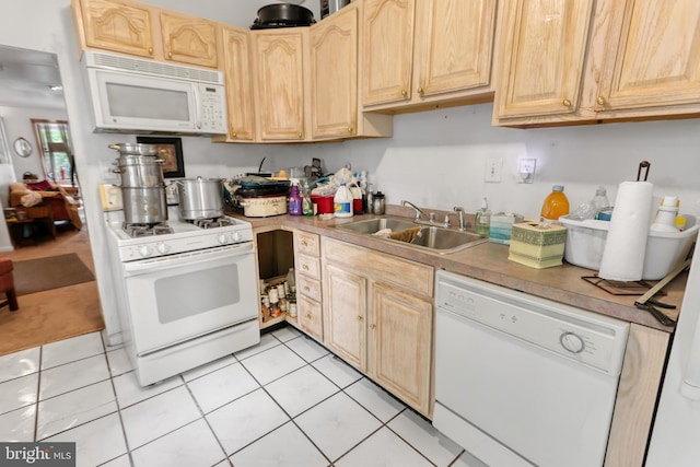 2227 Carter St, Wilmington, DE 19802 - kitchen featuring white appliances, a sink, light brown cabinets, light tile patterned flooring, and light countertops
