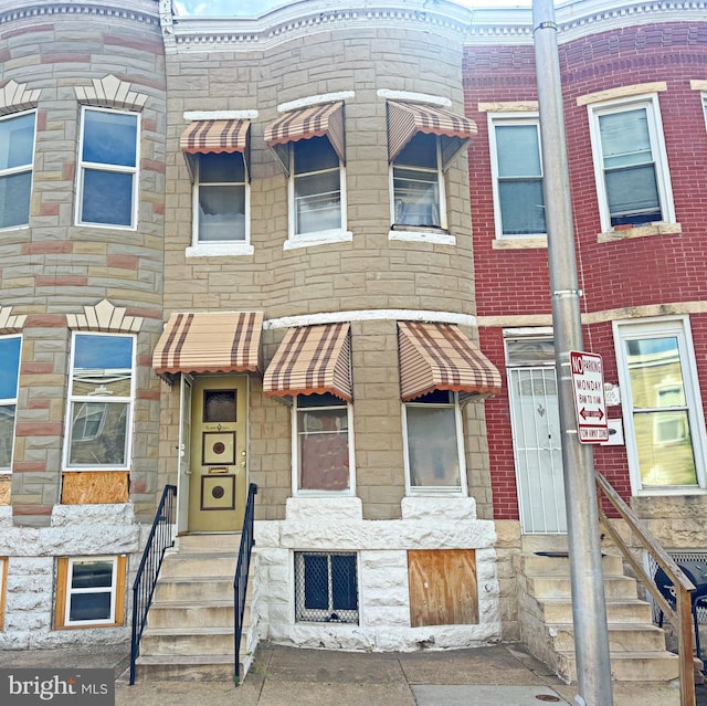 1007 Appleton St, Baltimore, MD 21217 - view of property featuring stone siding and entry steps