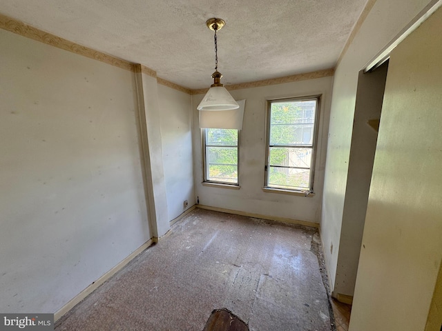 1007 Appleton St, Baltimore, MD 21217 - spare room featuring a textured ceiling and baseboards