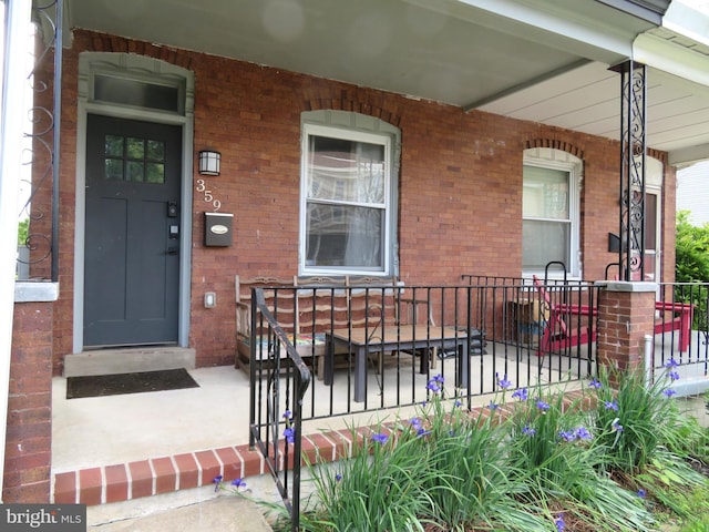 359 Lemonte St, Philadelphia, PA 19128 - view of exterior entry with covered porch and brick siding