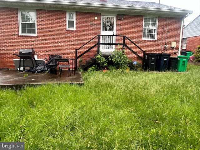 2402 Berkley St, Temple Hills, MD 20748 - back of house with brick siding and a patio area