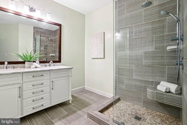 4691 Longstreet Ln Unit 202, Alexandria, VA 22311 - bathroom with a tile shower and double vanity