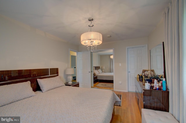 3405 Sundown Farms Way, Olney, MD 20832 - bedroom with a chandelier and light wood finished floors