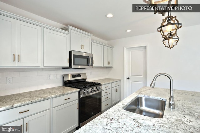6 Weston Cir Lot 61, Duncannon, PA 17020 - kitchen with stainless steel appliances, a sink, tasteful backsplash, decorative light fixtures, and recessed lighting