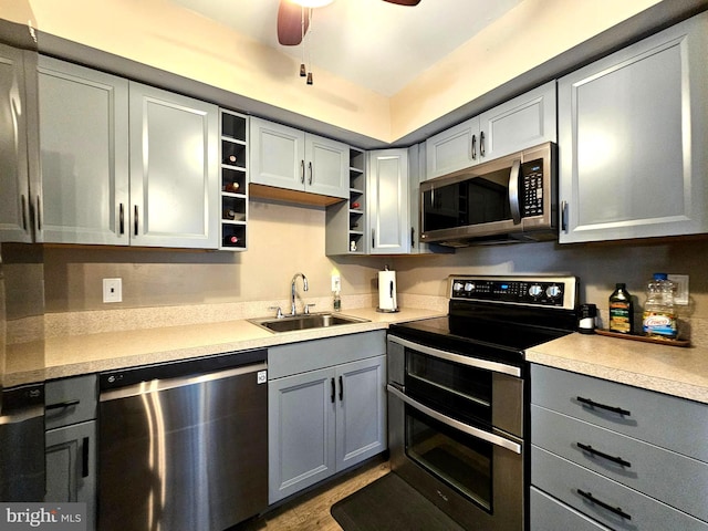 5200 Hilltop Dr Unit Bb-17, Brookhaven, PA 19015 - kitchen with stainless steel appliances, open shelves, gray cabinets, a ceiling fan, and light countertops