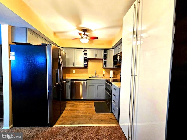 5200 Hilltop Dr Unit Bb-17, Brookhaven, PA 19015 - kitchen with stainless steel appliances, a ceiling fan, light countertops, open shelves, and wood finished floors