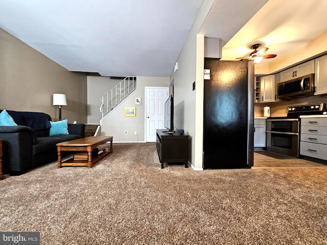 5200 Hilltop Dr Unit Bb-17, Brookhaven, PA 19015 - carpeted living area with stairs and ceiling fan