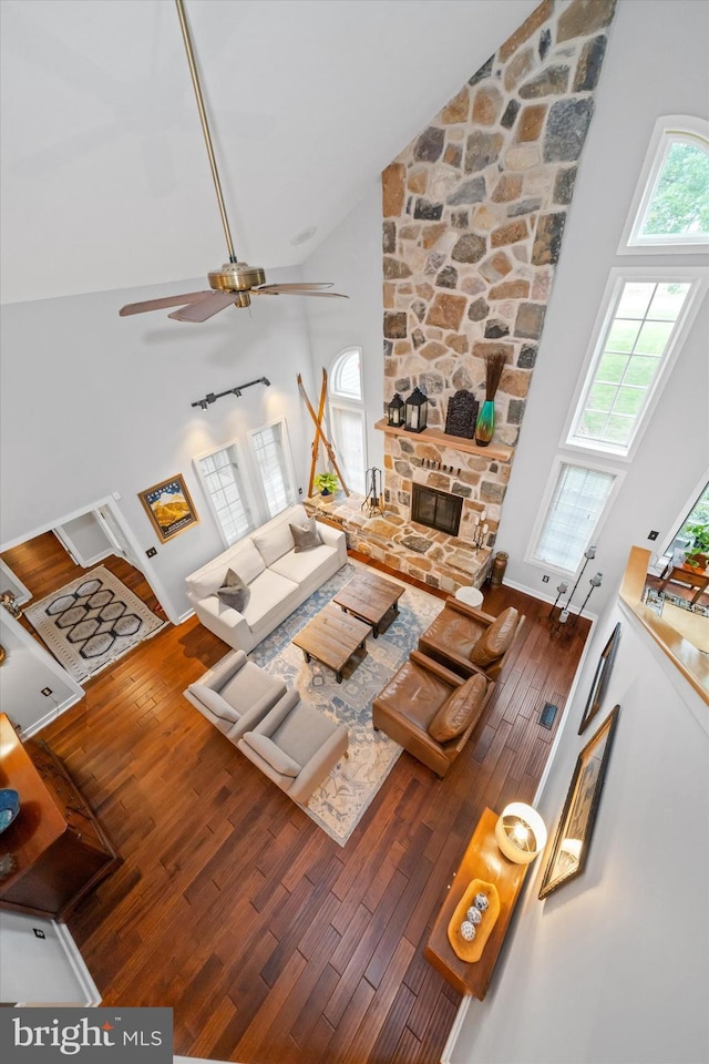 114 W Pembrey Dr, Wilmington, DE 19803 - living room with high vaulted ceiling, wood-type flooring, a ceiling fan, and a fireplace