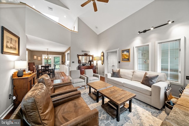 114 W Pembrey Dr, Wilmington, DE 19803 - living room with ceiling fan, high vaulted ceiling, and a chandelier