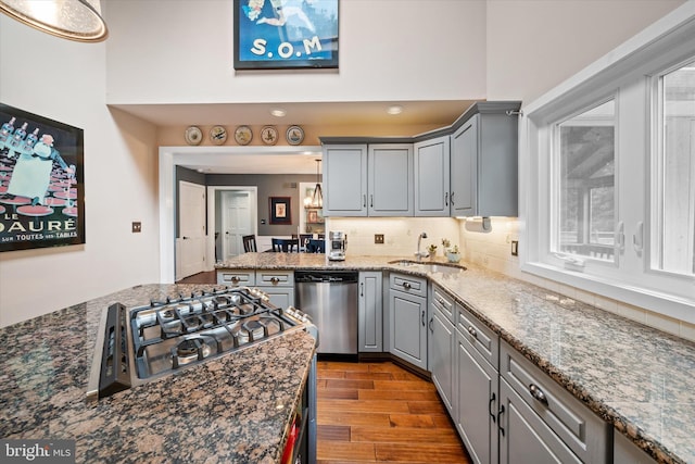 114 W Pembrey Dr, Wilmington, DE 19803 - kitchen featuring dishwasher, gray cabinets, wood finished floors, and tasteful backsplash