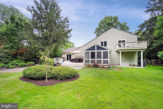 114 W Pembrey Dr, Wilmington, DE 19803 - rear view of house with a sunroom and a wooden deck