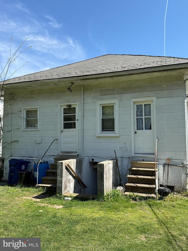 2905 Echodale Ave, Baltimore, MD 21214 - back of house featuring entry steps, a lawn, and roof with shingles