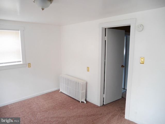 2905 Echodale Ave, Baltimore, MD 21214 - carpeted spare room featuring radiator heating unit, a smoke detector, and baseboards