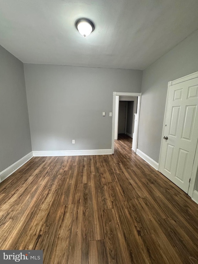 4549 N Mole St, Philadelphia, PA 19140 - empty room featuring dark wood-style floors and baseboards