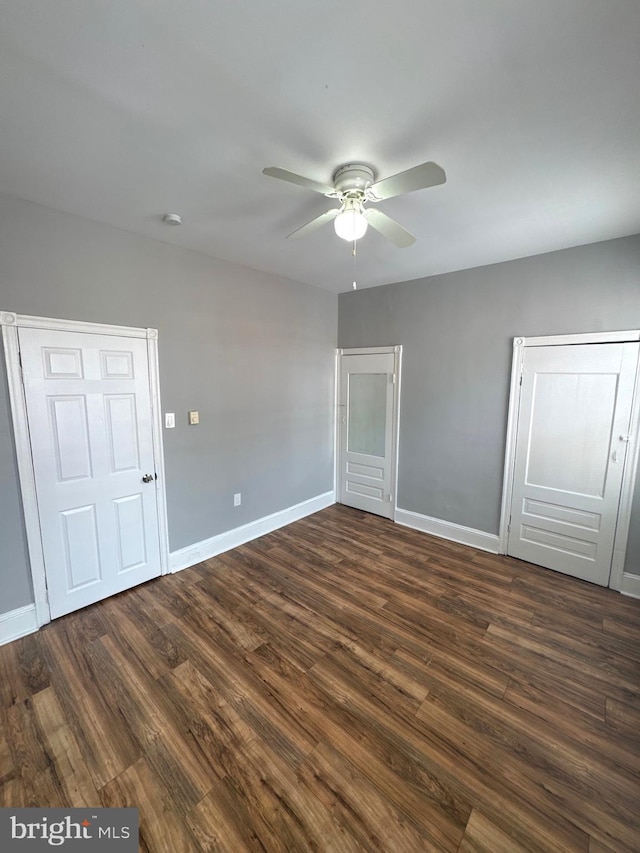 4549 N Mole St, Philadelphia, PA 19140 - unfurnished bedroom with dark wood-style flooring, baseboards, and ceiling fan