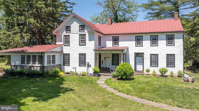 408 Kintner Hill Rd, Upper Black Eddy, PA 18972 - view of front of property with a standing seam roof, metal roof, a chimney, covered porch, and a front yard