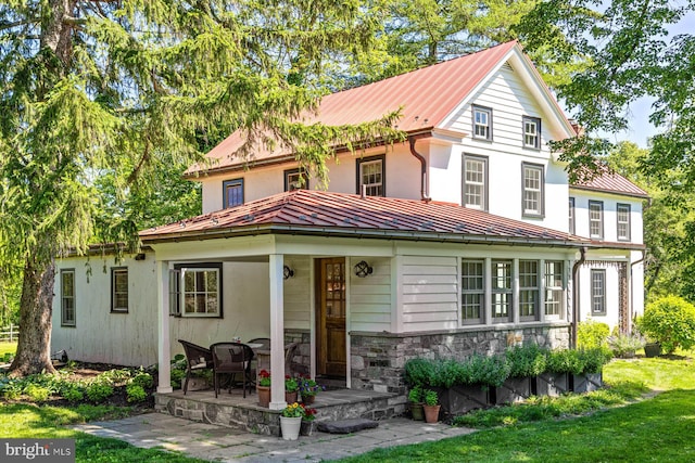 408 Kintner Hill Rd, Upper Black Eddy, PA 18972 - view of front of property with a standing seam roof, metal roof, stone siding, and a front lawn