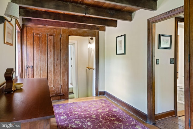 408 Kintner Hill Rd, Upper Black Eddy, PA 18972 - hallway featuring wood finished floors, beamed ceiling, and baseboards