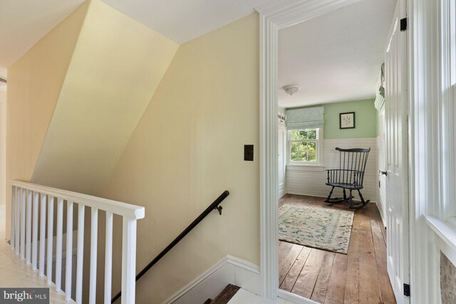 408 Kintner Hill Rd, Upper Black Eddy, PA 18972 - stairway with hardwood / wood-style floors, baseboards, and wainscoting