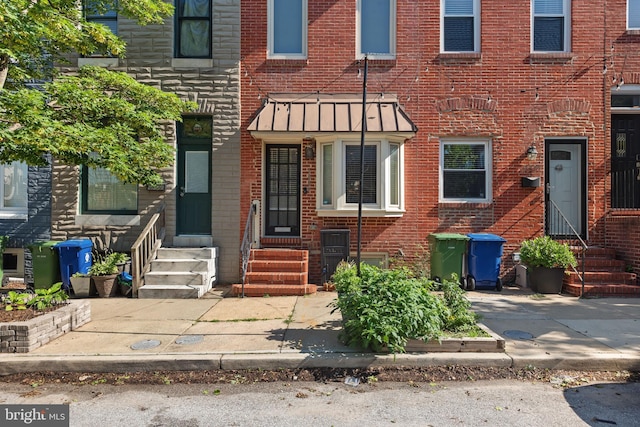 3006 Dillon St, Baltimore, MD 21224 - townhome / multi-family property with entry steps and brick siding