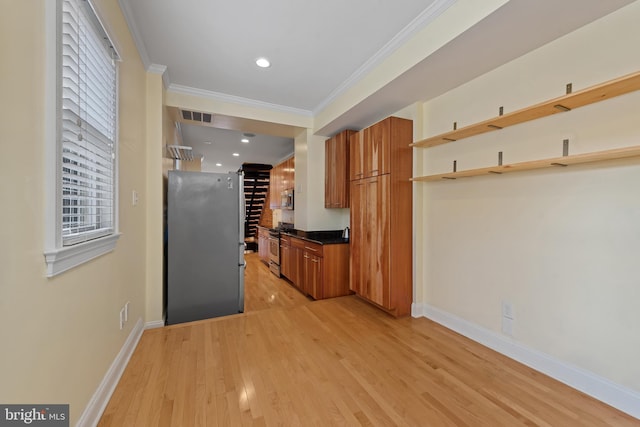3006 Dillon St, Baltimore, MD 21224 - kitchen featuring stainless steel appliances, brown cabinets, open shelves, ornamental molding, and light wood-style floors