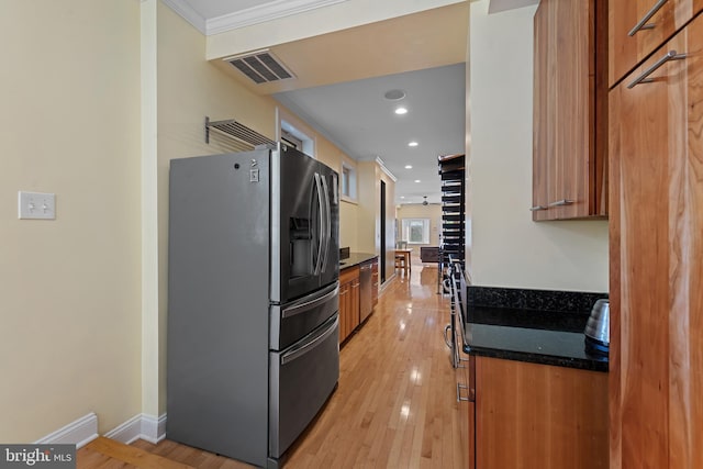 3006 Dillon St, Baltimore, MD 21224 - kitchen featuring stainless steel refrigerator with ice dispenser, brown cabinets, light wood-type flooring, recessed lighting, and baseboards