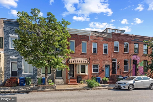 3006 Dillon St, Baltimore, MD 21224 - townhome / multi-family property featuring brick siding and entry steps