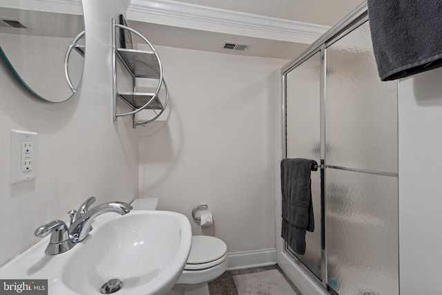 3006 Dillon St, Baltimore, MD 21224 - bathroom with a sink, a shower stall, toilet, baseboards, and crown molding