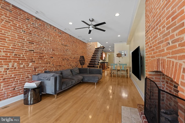 3006 Dillon St, Baltimore, MD 21224 - living area featuring a ceiling fan, baseboards, light wood-style floors, stairway, and recessed lighting