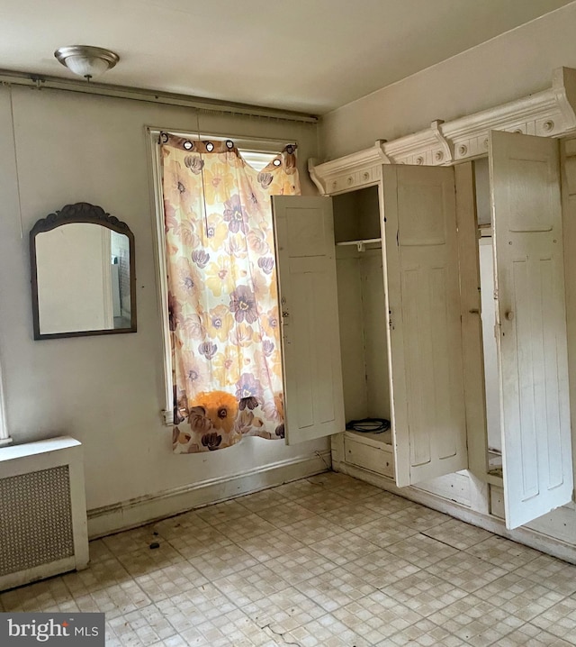 542 W Tioga St, Philadelphia, PA 19140 - unfurnished bedroom featuring radiator and light flooring