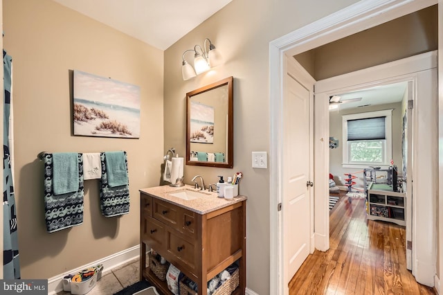 3203 Beverly Rd, Baltimore, MD 21214 - bathroom featuring vanity, wood-type flooring, and baseboards