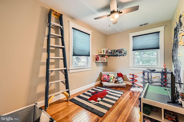 3203 Beverly Rd, Baltimore, MD 21214 - recreation room featuring hardwood / wood-style floors, baseboards, and ceiling fan